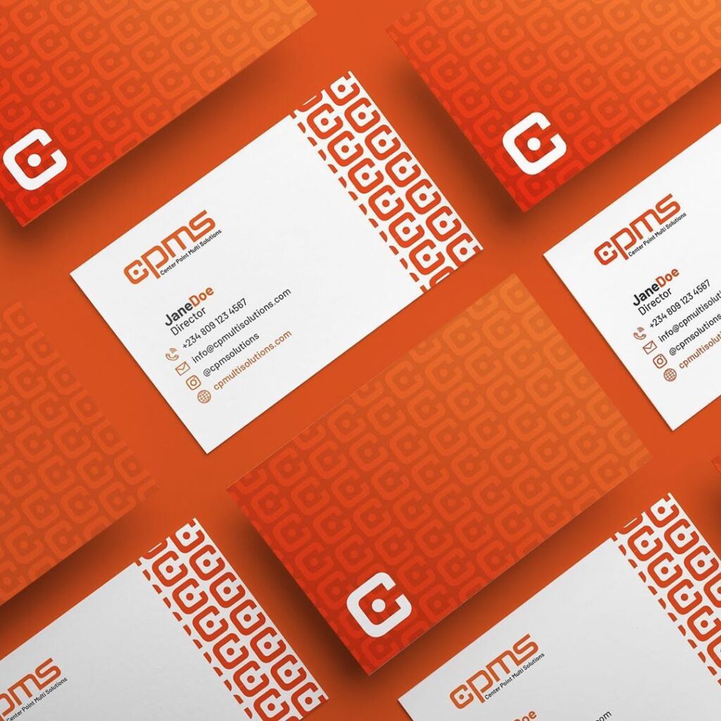 Orange business cards with a white geometric logo